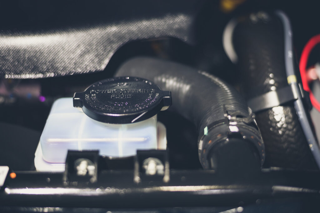Power steering fluid reservoir in a new car