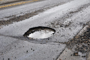 a Large Pothole on a Fredericksburg Area Road A large pothole on a Fredericksburg area road