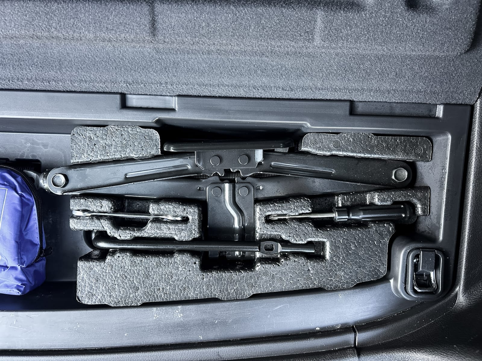 A vehicle essential roadside assistance kit
