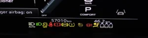 Many different car dashboard lights with warning lamps illuminated Light symbol that pops up on dashboard when something goes wrong with the engine Close up shot of hybrid car instrument panel