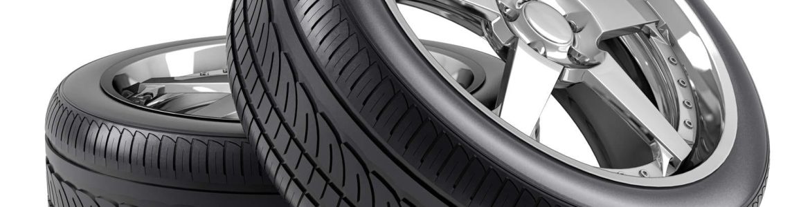 Image of two new tires stacked on top of each other - Essential Guide to Auto Tire Maintenance